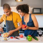 Couple preparing a meal together in their home kitchen
