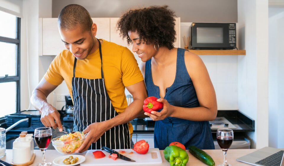 Couple preparing a meal together in their home kitchen
